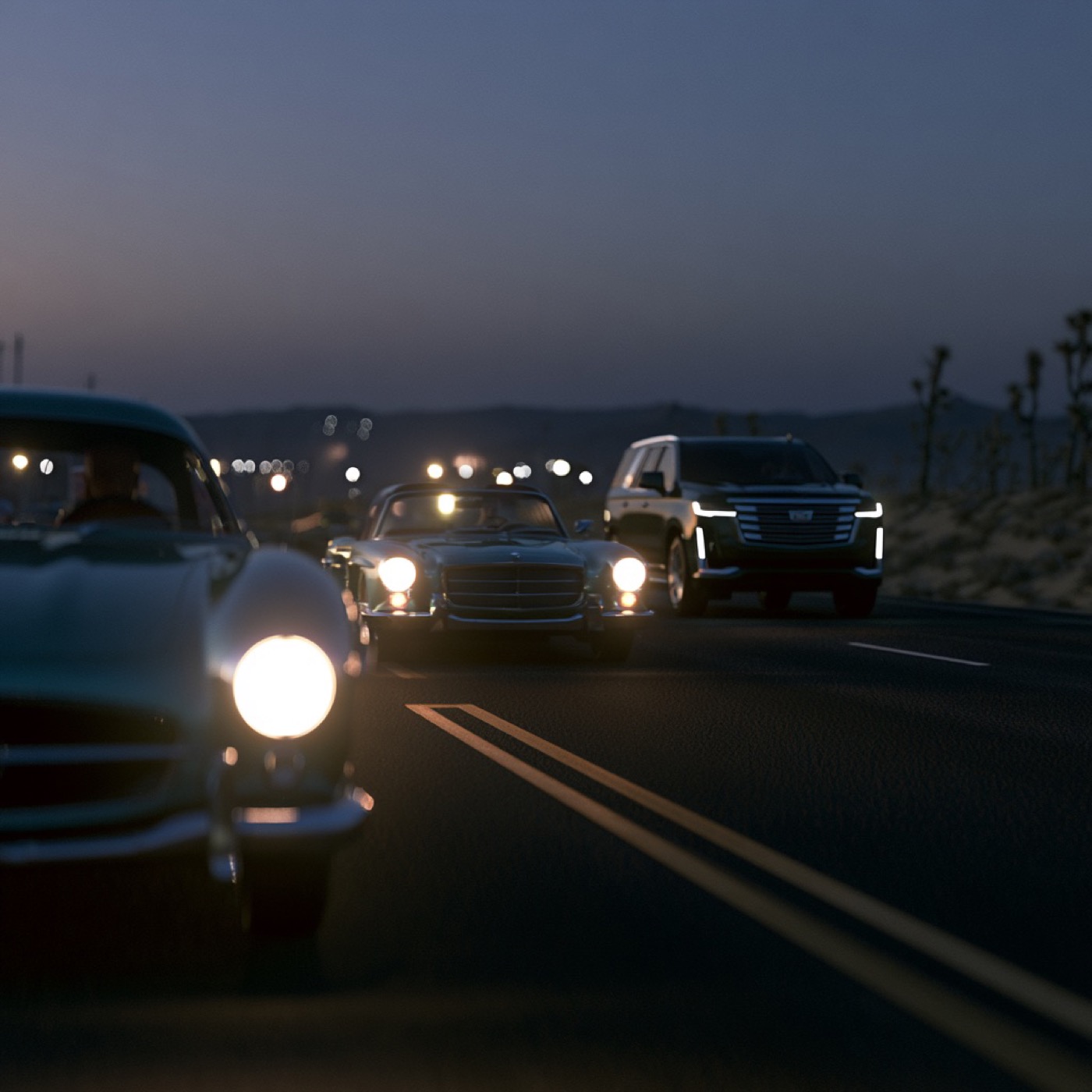 Black Cadillac Escalade leading classic cars along a country road at dusk