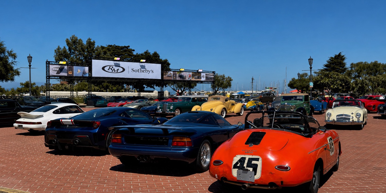 Classic and exotic cars gathered on a harborside plaza during Monterey Car Week